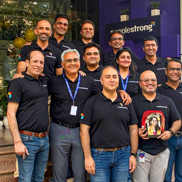 PeopleStrong Team standing infront of the office